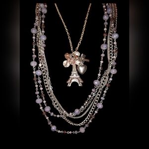 Two silvertone necklaces beaded multistrand and eiffel tower